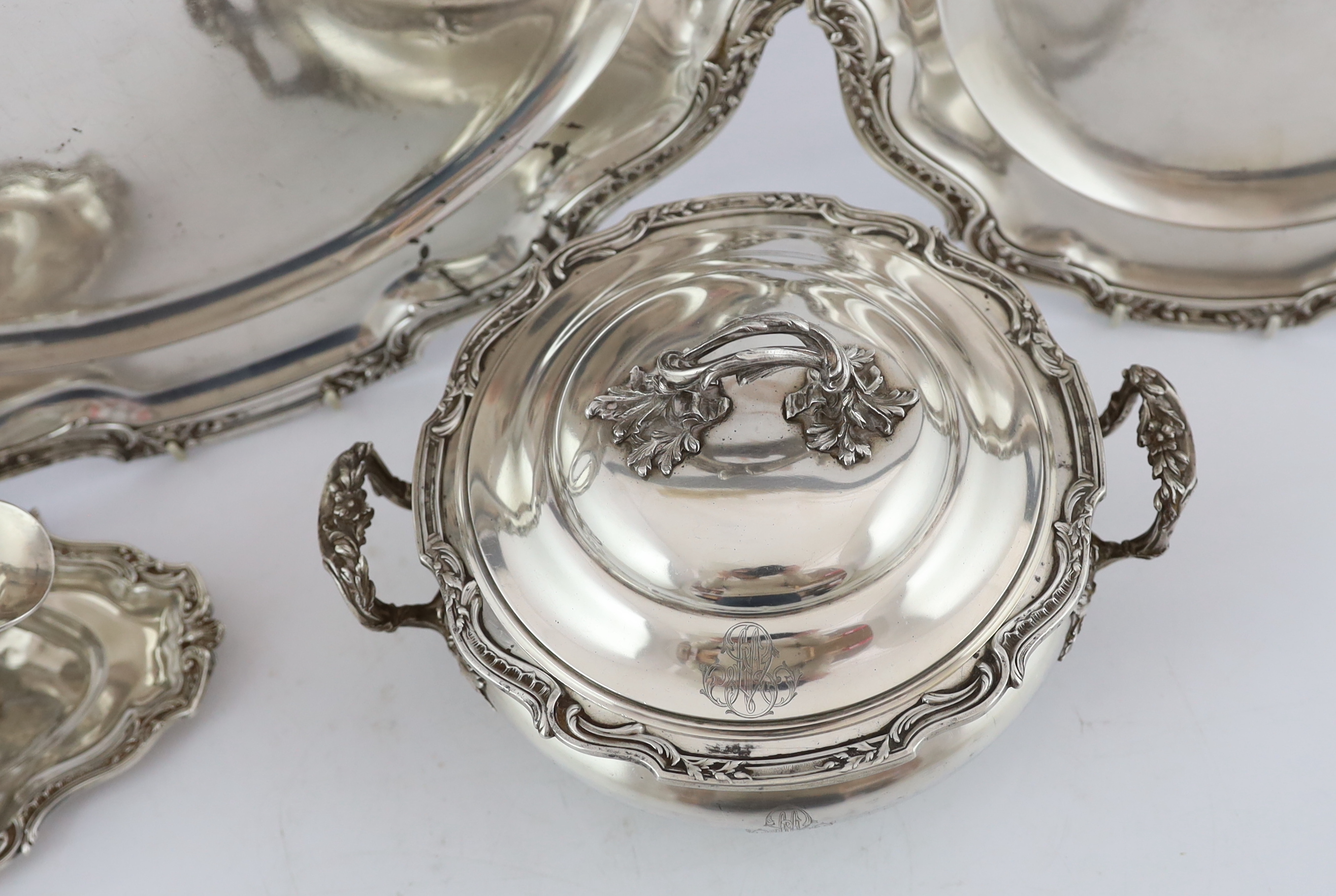A late 19th century French 950 standard silver tureen and cover, a sauceboat on fixed stand and two serving dishes, by V. Boivin, Paris